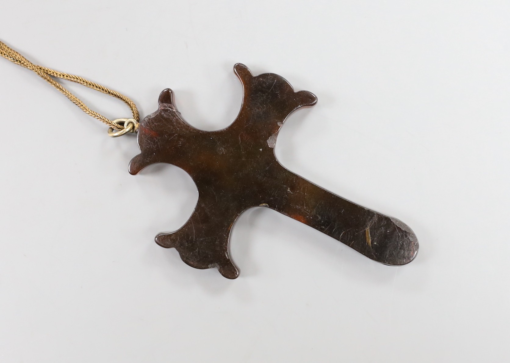 A Victorian tortoiseshell and yellow metal pique cross pendant, 73mm, on a gilt metal chain.